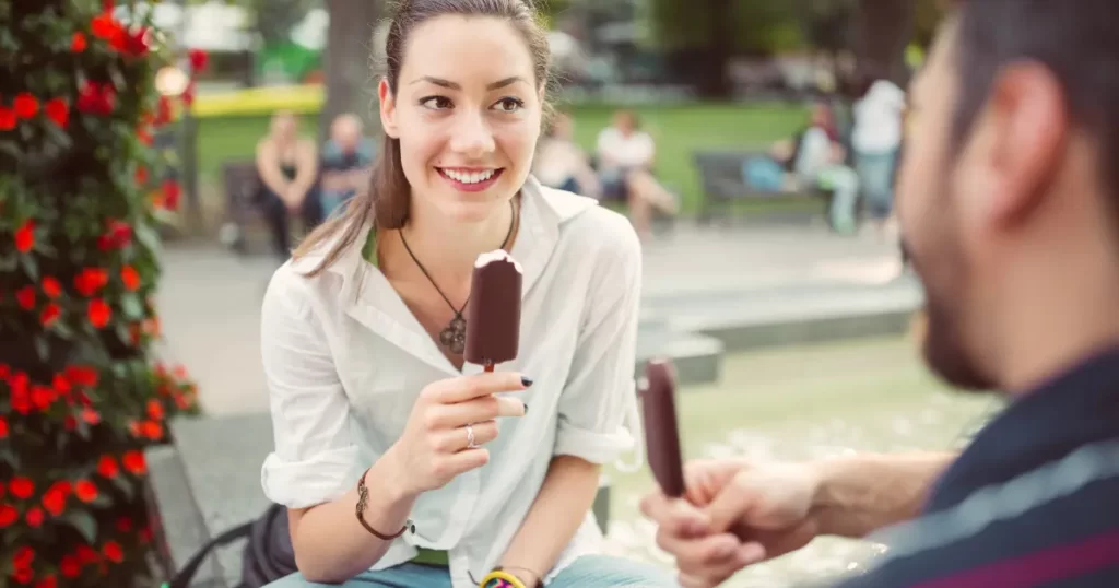 Couple on a first date eating ice-cream.